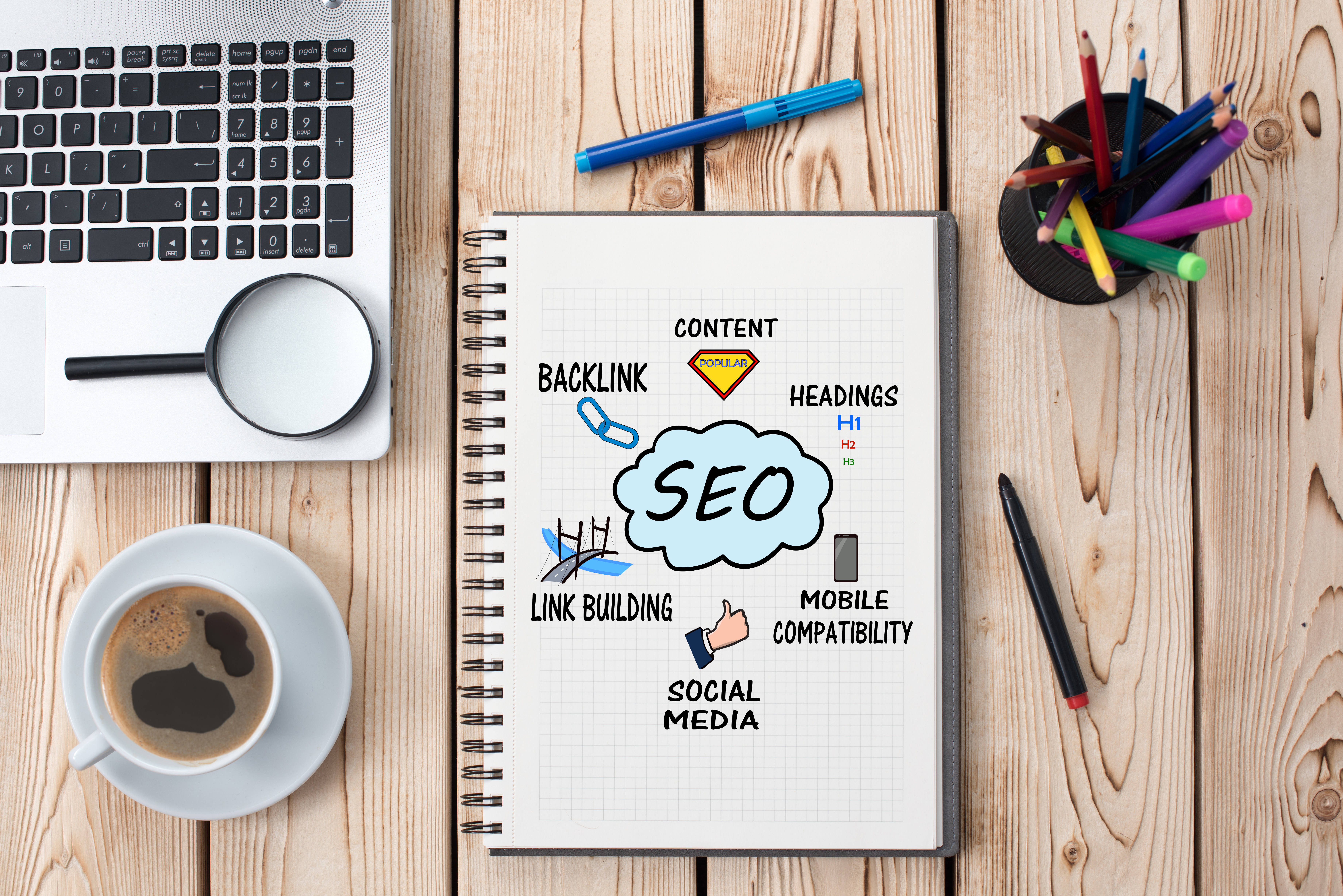 Notebook with search engine optimization written on it